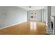 Spacious living room with hardwood floors, large window, and neutral paint at 718 W Trade St # 708, Charlotte, NC 28202