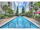 Relaxing swimming pool area offering a refreshing oasis surrounded by greenery at 718 W Trade St # 708, Charlotte, NC 28202