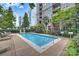 Beautiful outdoor swimming pool surrounded by lush landscaping and lounging areas at 718 W Trade St # 708, Charlotte, NC 28202