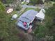 Aerial view of the home with a large backyard deck area, shed and landscaping at 8044 Eagle St, Mount Pleasant, NC 28124