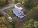 Drone shot of the landscaped home with back deck and yard, shed and carport at 8044 Eagle St, Mount Pleasant, NC 28124