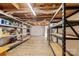 Unfinished basement featuring a concrete floor, shelving and exposed duct work at 8044 Eagle St, Mount Pleasant, NC 28124