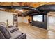 Finished basement with a large sectional couch and big screen tv, great for entertaining at 8044 Eagle St, Mount Pleasant, NC 28124