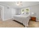 Bright bedroom featuring carpet, two windows, and neutral walls at 8044 Eagle St, Mount Pleasant, NC 28124