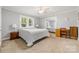 Cozy bedroom with natural light, carpet, and a ceiling fan at 8044 Eagle St, Mount Pleasant, NC 28124
