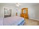 Well-lit bedroom with wood furniture at 8044 Eagle St, Mount Pleasant, NC 28124