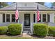 Welcoming entrance with American flags and manicured bushes at 8044 Eagle St, Mount Pleasant, NC 28124