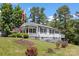 Beautiful home with green lawn, flag, and flowers at 8044 Eagle St, Mount Pleasant, NC 28124