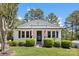 Inviting home exterior featuring American flags, well-maintained landscaping, and a welcoming entrance at 8044 Eagle St, Mount Pleasant, NC 28124