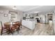 Kitchen and dining area with light flooring, an island, and stainless steel appliances at 8044 Eagle St, Mount Pleasant, NC 28124