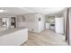 Kitchen with white cabinets and new appliances, plus adjacent laundry area at 8044 Eagle St, Mount Pleasant, NC 28124