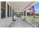 View of porch with swing and American flags at 8044 Eagle St, Mount Pleasant, NC 28124