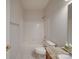 Bathroom with a granite vanity, toilet, and shower-tub combination, ideal for comfortable living at 8623 Cedar Hollow Ln, Huntersville, NC 28078