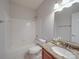 Bathroom with a granite vanity, toilet, and shower-tub combination offering modern conveniences at 8623 Cedar Hollow Ln, Huntersville, NC 28078