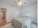 Cozy bedroom with a ceiling fan, closet, and a comfortable queen-size bed, complete with a rug at 8623 Cedar Hollow Ln, Huntersville, NC 28078