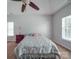 Bedroom with neutral carpet, a tray ceiling, a window, a ceiling fan, and a decorative nightstand at 8623 Cedar Hollow Ln, Huntersville, NC 28078