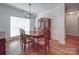 Formal dining room with hardwood floors, elegant chandelier, and classic furnishings at 8623 Cedar Hollow Ln, Huntersville, NC 28078