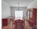 Bright dining room with hardwood floors, traditional furniture, and ample natural light at 8623 Cedar Hollow Ln, Huntersville, NC 28078