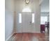 Elegant entryway with hardwood floors, sidelights, and transom window above the front door at 8623 Cedar Hollow Ln, Huntersville, NC 28078