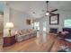 Cozy living room with a fireplace, hardwood floors, and comfortable seating at 8623 Cedar Hollow Ln, Huntersville, NC 28078