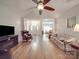 Spacious living room with wood floors, fireplace, and open floor plan at 8623 Cedar Hollow Ln, Huntersville, NC 28078