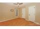 Comfortable bedroom with hardwood floors, a ceiling fan, and a window at 867 Southwest Dr, Davidson, NC 28036