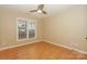 Bright, inviting bedroom featuring hardwood floors and a sunlit window at 867 Southwest Dr, Davidson, NC 28036