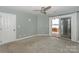 Bedroom with plush carpeting and patio access overlooking the waterfront at 867 Southwest Dr, Davidson, NC 28036