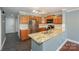 Bright kitchen with stainless steel appliances, granite countertops, and a breakfast bar at 867 Southwest Dr, Davidson, NC 28036