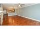 Open-concept living room boasts hardwood floors and connects to a modern kitchen at 867 Southwest Dr, Davidson, NC 28036