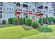 Charming ground floor patio with seating area and landscaped bushes at 867 Southwest Dr, Davidson, NC 28036