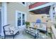 Charming patio area furnished with outdoor seating, a coffee table, and potted plants at 867 Southwest Dr, Davidson, NC 28036