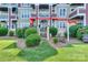 Ground floor patio with seating area, steps to yard, and privacy landscaping at 867 Southwest Dr, Davidson, NC 28036