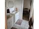 Bathroom with dual vanities and access to bedroom at 9535 Potter Rd, Matthews, NC 28104