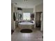 Bright bathroom featuring a corner soaking tub and large window at 9535 Potter Rd, Matthews, NC 28104