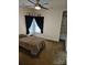 Cozy bedroom with window, ceiling fan, and shelving at 9535 Potter Rd, Matthews, NC 28104