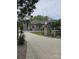 Attractive one-story home with brick exterior, driveway, manicured lawn, and palm trees at 9535 Potter Rd, Matthews, NC 28104