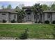 Elegant one-story home featuring a brick facade, well-maintained lawn, and mature palm trees at 9535 Potter Rd, Matthews, NC 28104