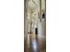 Inviting hallway featuring hardwood floors, high ceilings, and arched doorways at 9535 Potter Rd, Matthews, NC 28104