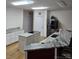 Bright kitchen featuring stainless steel appliances, light wood flooring and counter with island at 9535 Potter Rd, Matthews, NC 28104