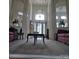 Open-concept living room featuring high ceilings, decorative art niches, and plush carpeting at 9535 Potter Rd, Matthews, NC 28104