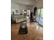 Spacious living room featuring hardwood floors, a neutral-colored couch and access to the patio at 9535 Potter Rd, Matthews, NC 28104