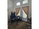 Bright home office with arched windows, neutral paint, and comfortable seating at 9535 Potter Rd, Matthews, NC 28104