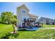 Beautiful home with a deck, a gazebo and green lawn in the backyard at 9860 Darby Creek Nw Ave, Concord, NC 28027