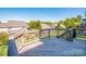 Spacious wooden backyard deck overlooking lush greenery and neighboring houses at 9860 Darby Creek Nw Ave, Concord, NC 28027