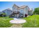 Lush backyard with a patio, gazebo, deck, and well-maintained landscaping at 9860 Darby Creek Nw Ave, Concord, NC 28027