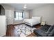 Bedroom with hardwood floors, a queen bed, and a window seat at 9860 Darby Creek Nw Ave, Concord, NC 28027