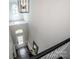 High angle shot of an entry foyer featuring a stunning chandelier and staircase at 9860 Darby Creek Nw Ave, Concord, NC 28027