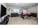 Game room featuring a pool table, sitting area, TV, and neutral carpet at 9860 Darby Creek Nw Ave, Concord, NC 28027