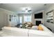 Bright living room featuring a fireplace, ceiling fan, and access to the outdoor area at 9860 Darby Creek Nw Ave, Concord, NC 28027